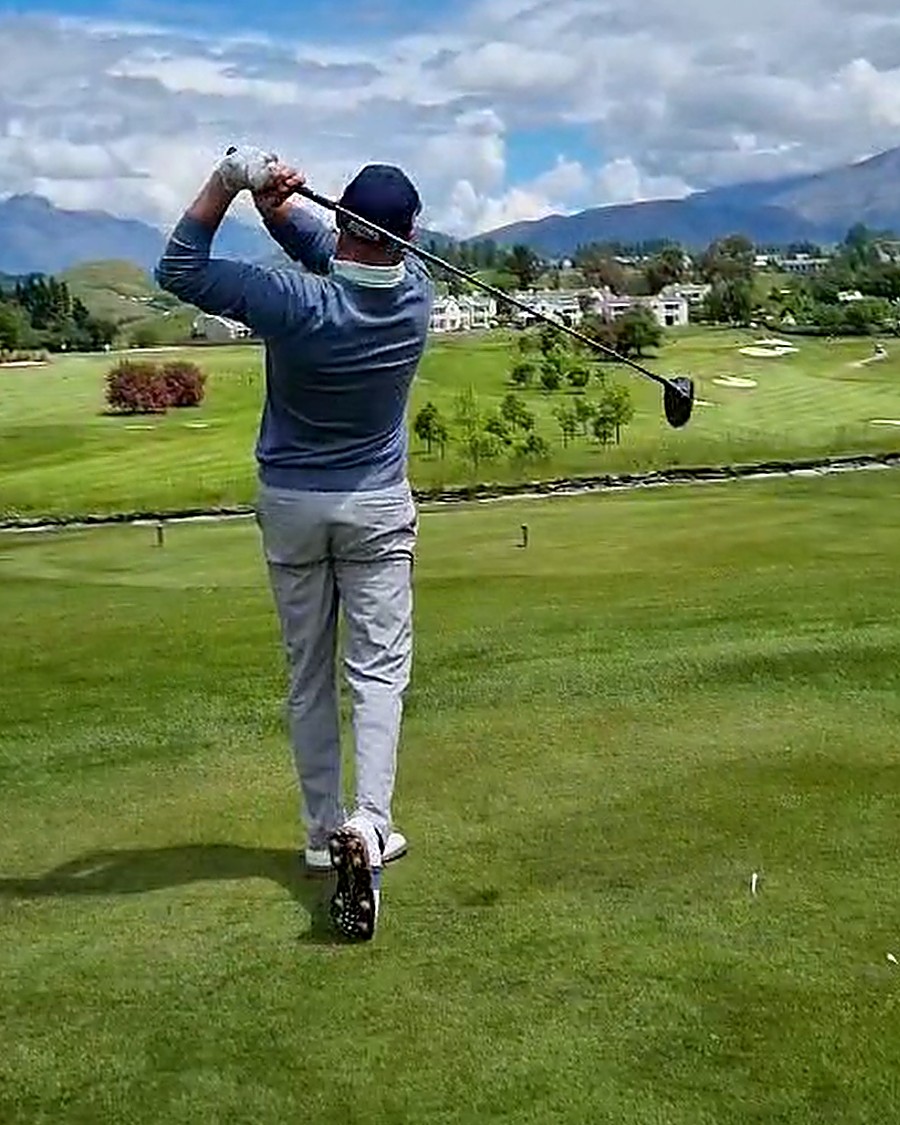 Ivan Howe holding his finish after a drive from the tee